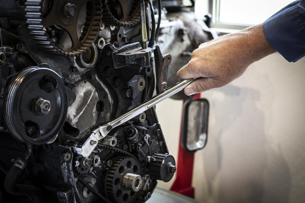 Gearwrench ratchet being used on an engine