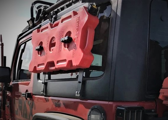 rotopax utility jug mounted to the side of a jeep