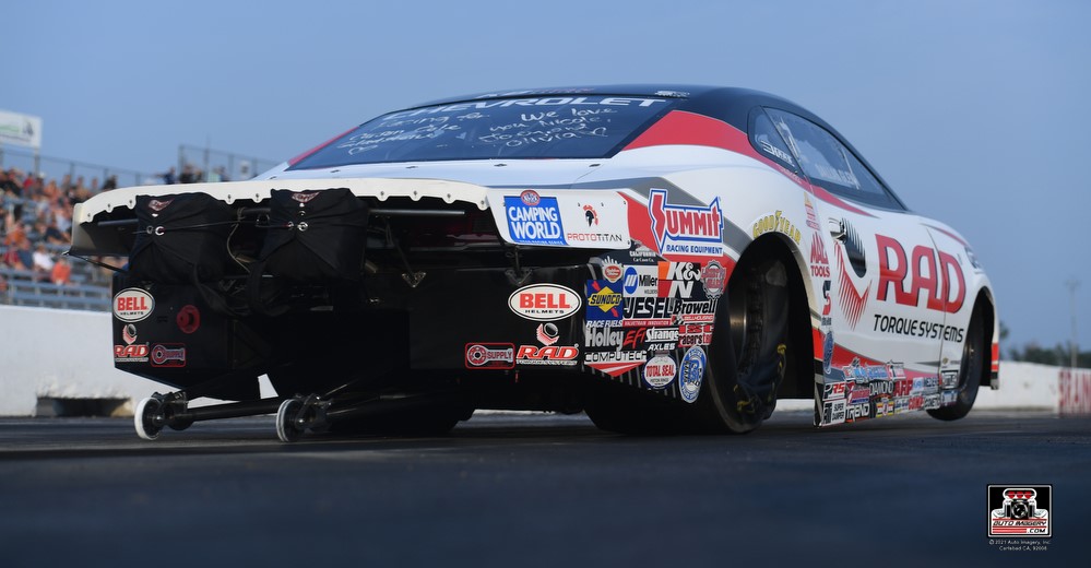 rear view of dallas glenn's pro stock Camaro launching at nhra drag race