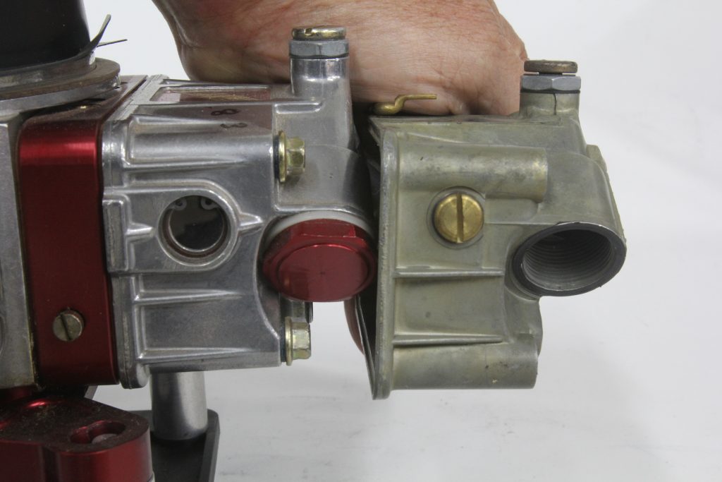 a side by side comparison of 2 carburetor fuel bowls