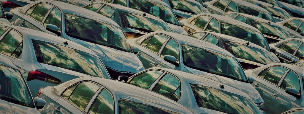 Rows of a new cars parked in a parking lot