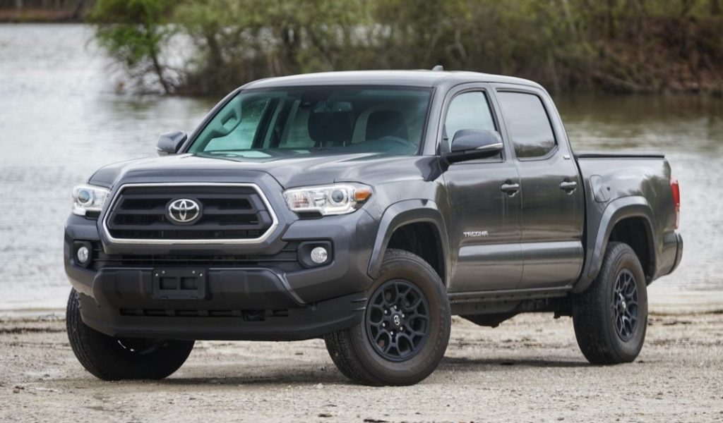 2023 toyota tacoma truck in front of a lake