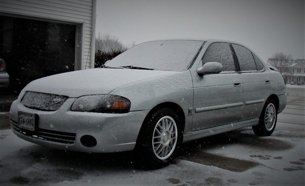 2004 nissan sentra se-r covered in snow in driveway