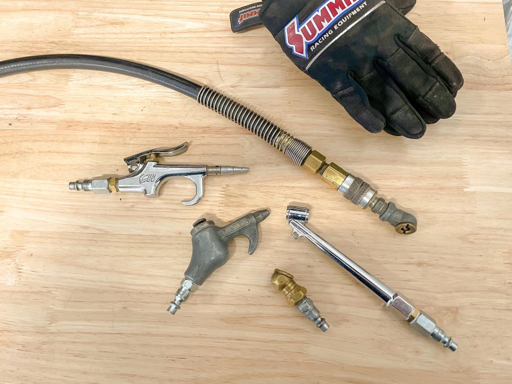 Assorted air hoses and fittings on a workbench