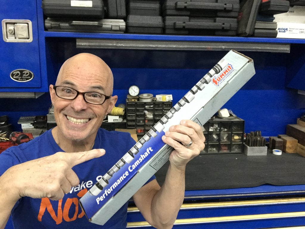 man holding a camshaft box