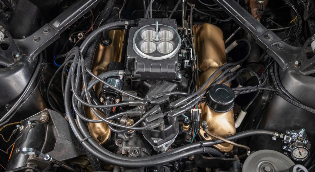 holley sniper 2 throttle body efi module installed on an engine