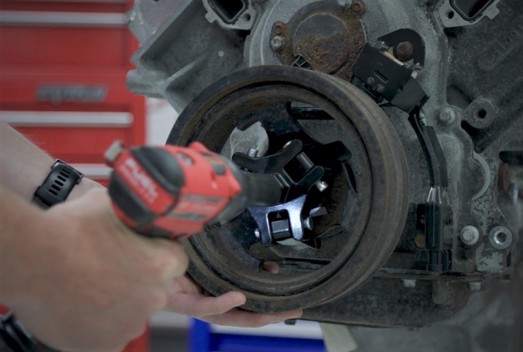 Removing a harmonic balancer with a puller tool