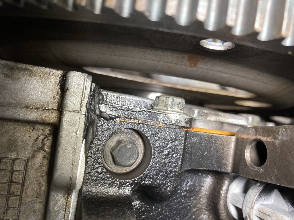 close up of space between engine block and flywheel