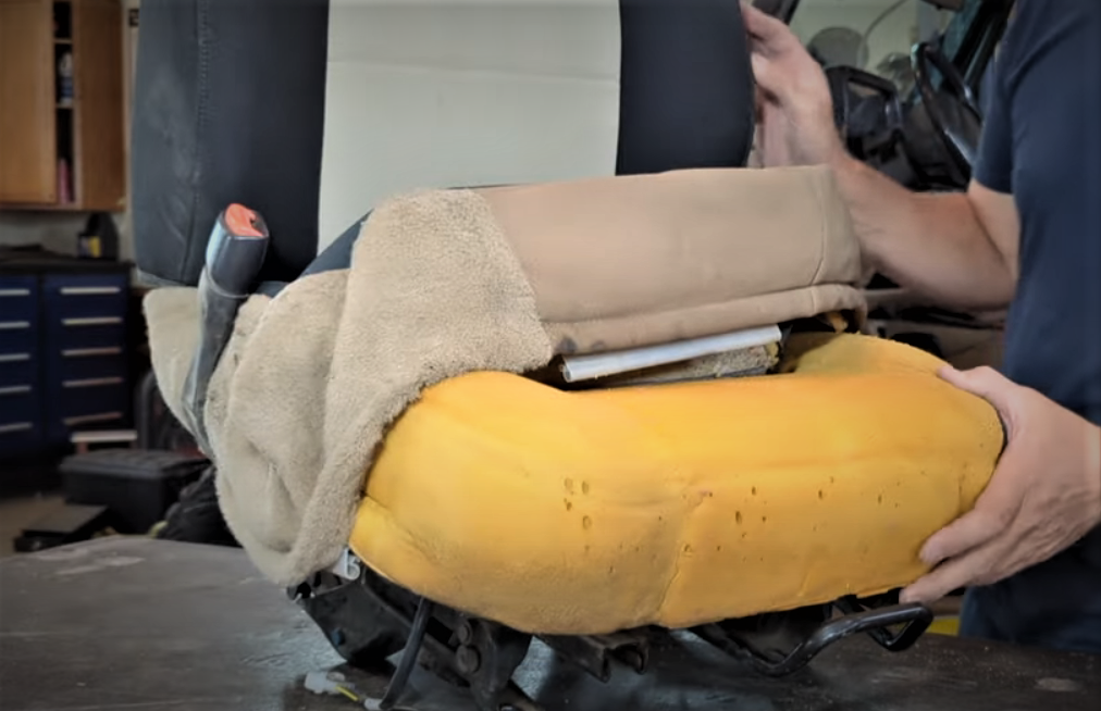 jeep wrangler seat with cover removed to show exposed foam cushion