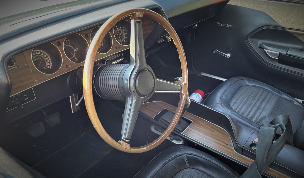 interior shot of a 1970 plymouth aar cuda dash and steering wheel