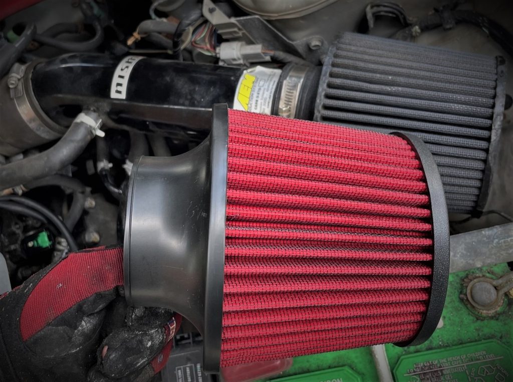 man holding an air filter element