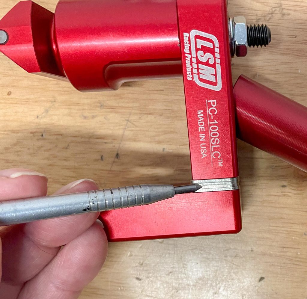 Adjustment shims on LSM valve seat pressure tool