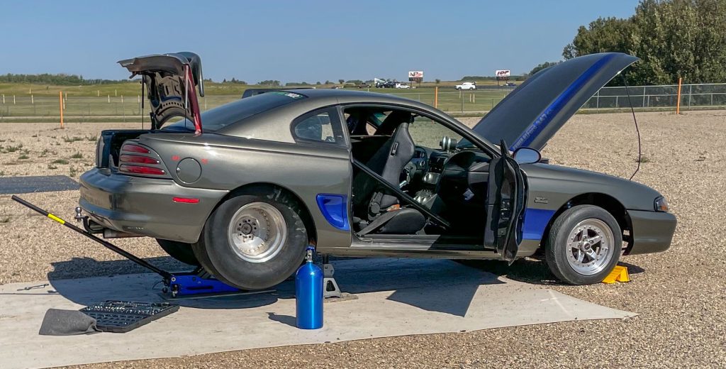 Drag race Mustang on jack stands