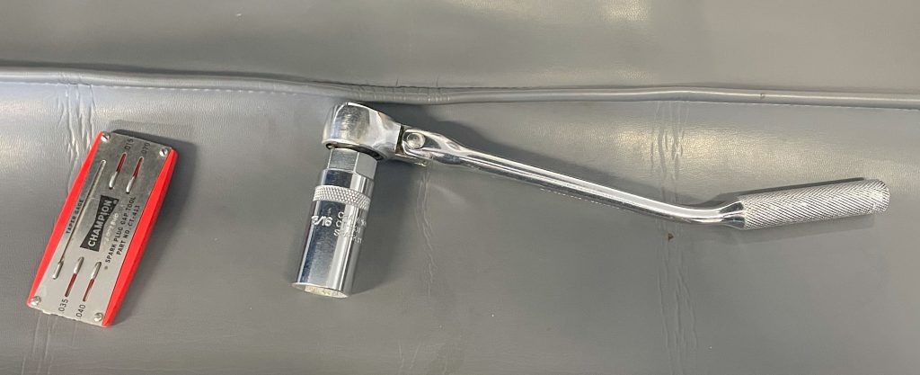 Spark plug wrench and gapping tool