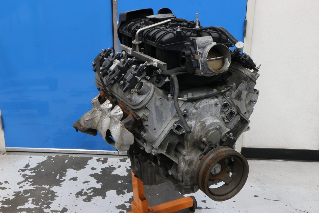 Junkyard LS engine resting on a stand