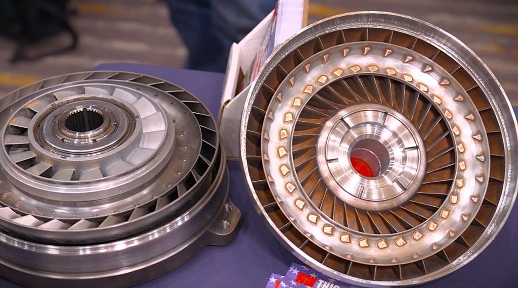 a pair of uncovered torque converters on table
