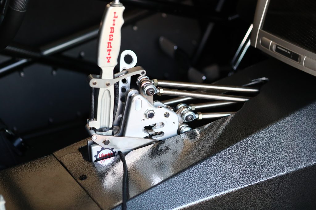 close up of a drag race car's pistol shifter