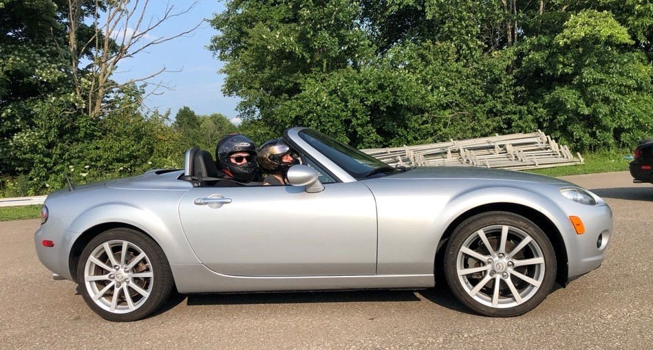 2 people in an NC Miata convertible