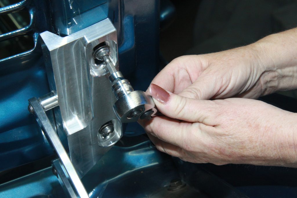Tightening Eddie Motorsports hinge to hood bolts