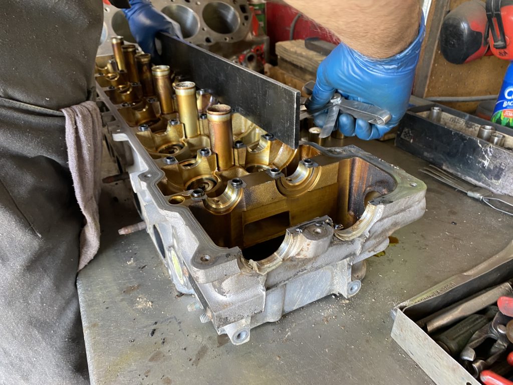 using a straightedge to check and cylinder head