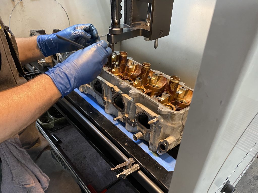 removing parts from an engine cylinder head