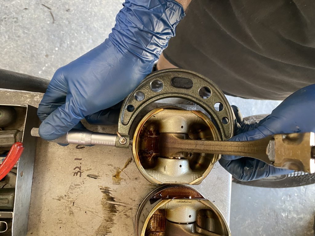 measuring piston diameter with a micrometer