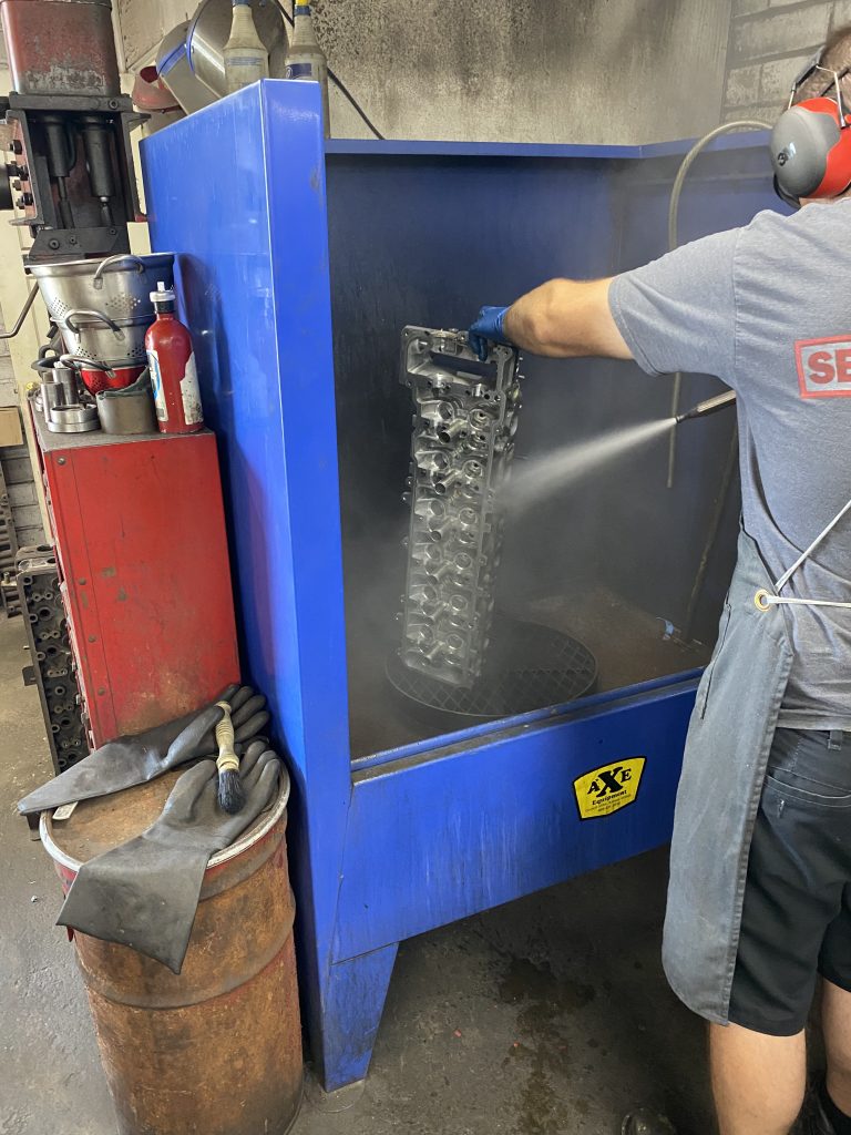 pressure washing a cylinder head