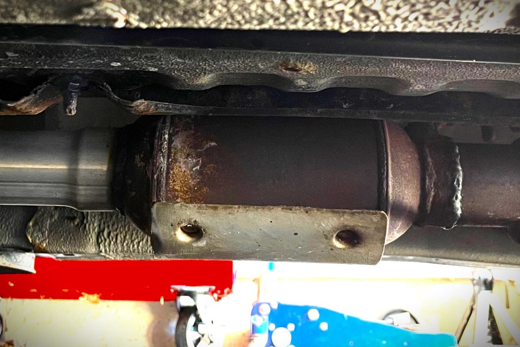 Aftermarket Catalytic Converter Welded on a Car