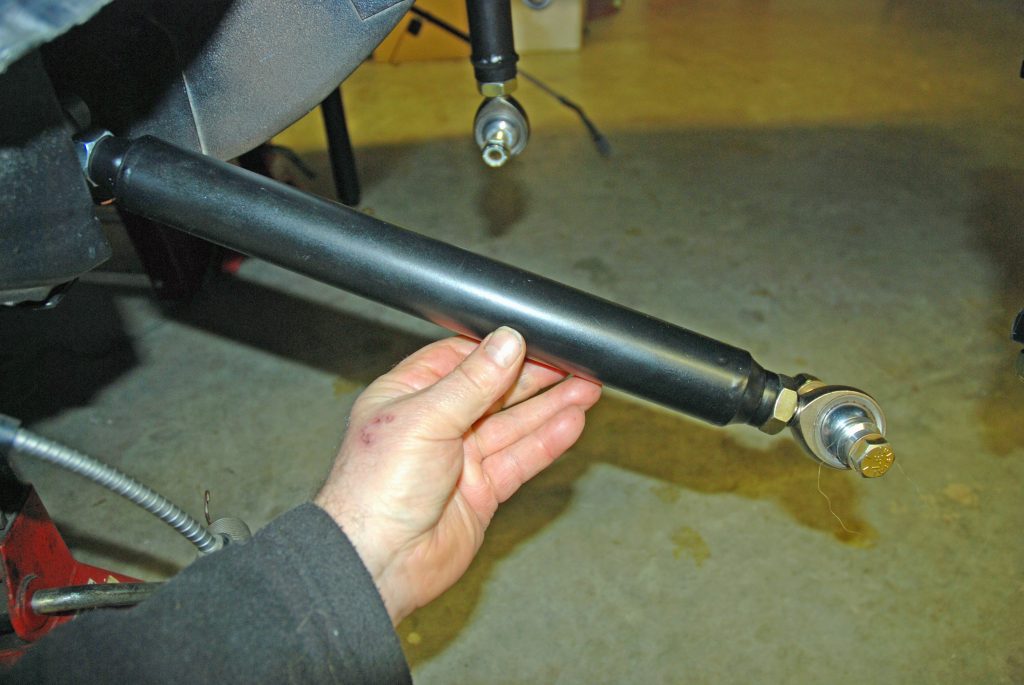 Rod end on rear trailing arm