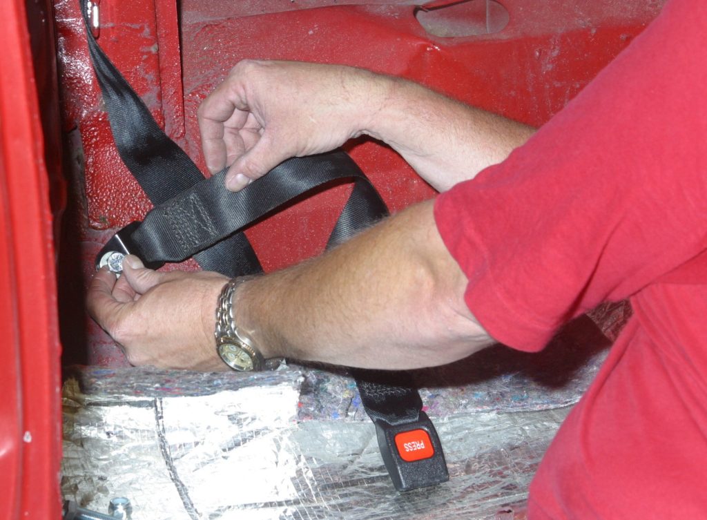 Installing rear seat belt buckle