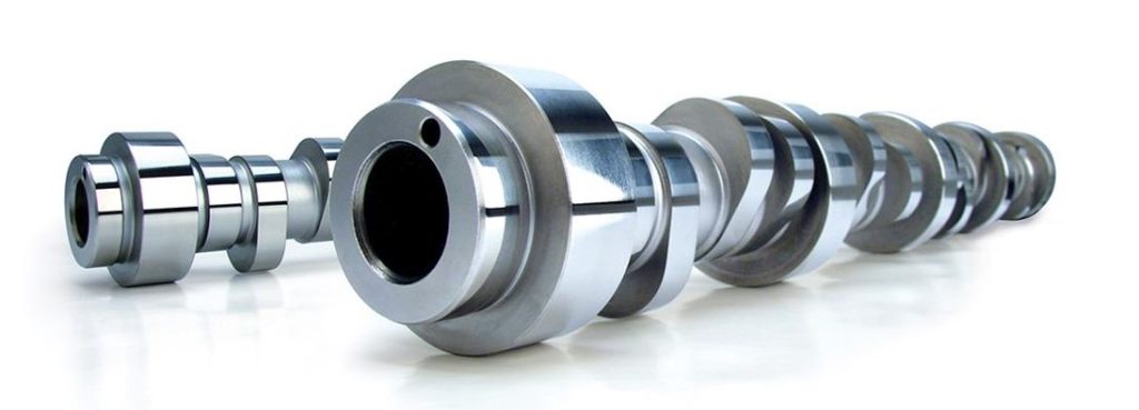 a pair of COMP Camshafts