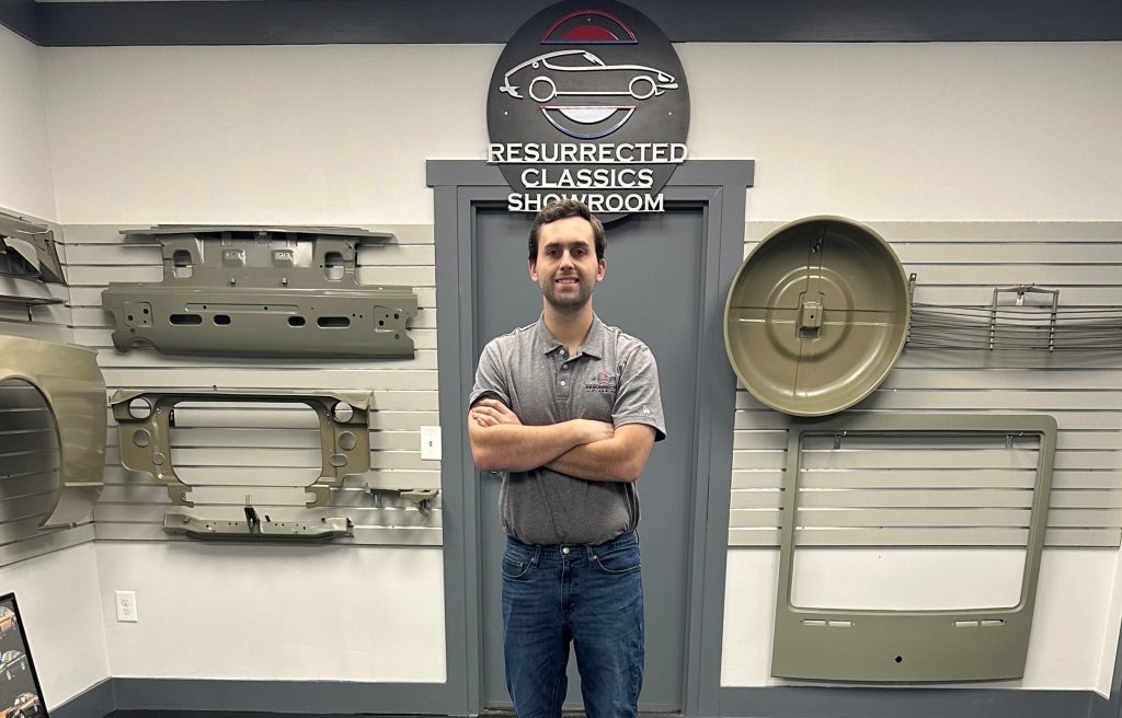 man standing in an auto parts showroom