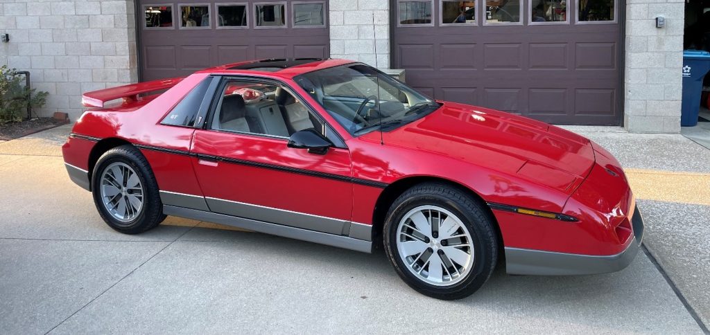 red Pontiac Fiero with plastic Wheels
