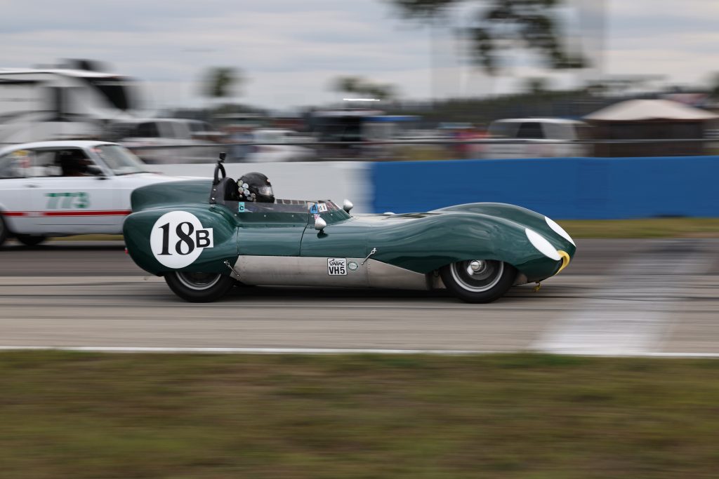 vintage le mans prototype race car on track, side view