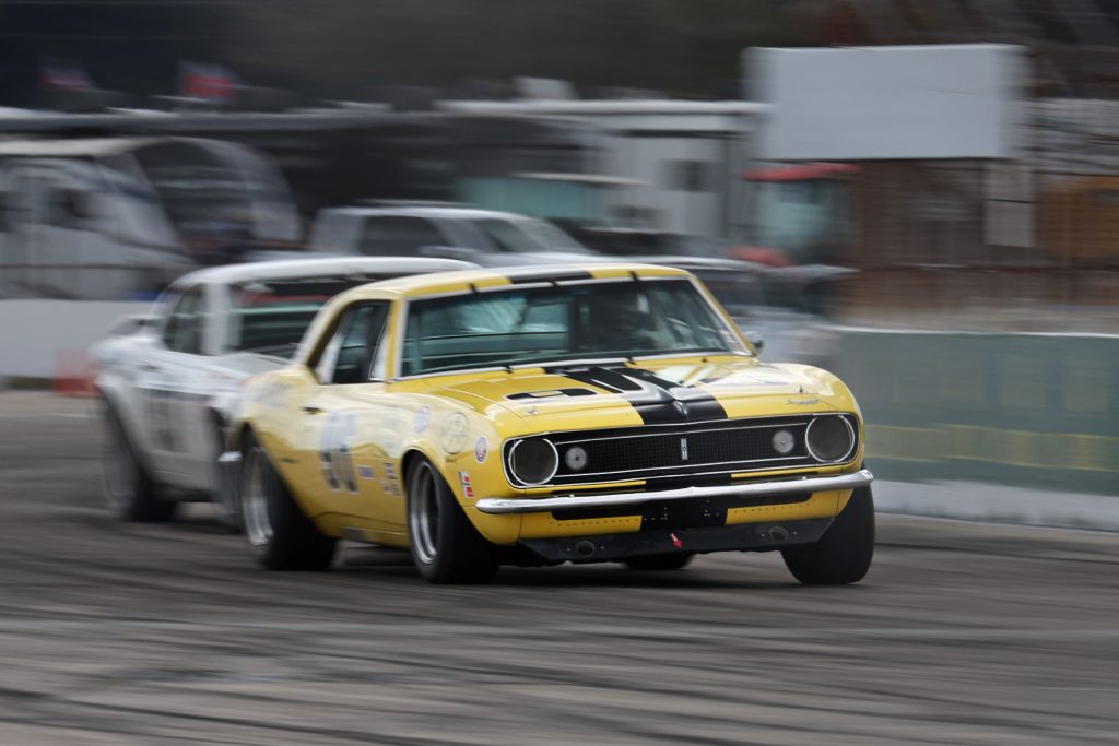 Vintage Yellow Camaro Trans Am Car exiting a corner
