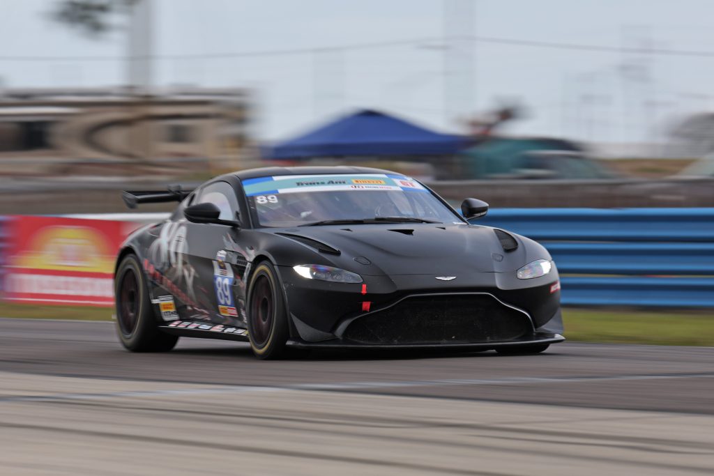 Black Aston Martin Vantage Race Car on Track