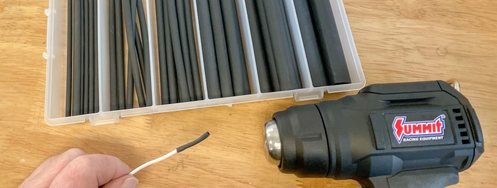 Applying heat shrink to wire