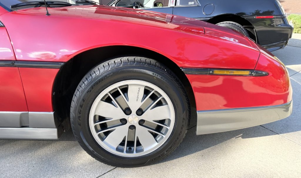 Front plastic wheel on a pontiac fiero