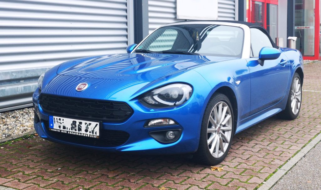 Fiat 124 Spider parked on European Street