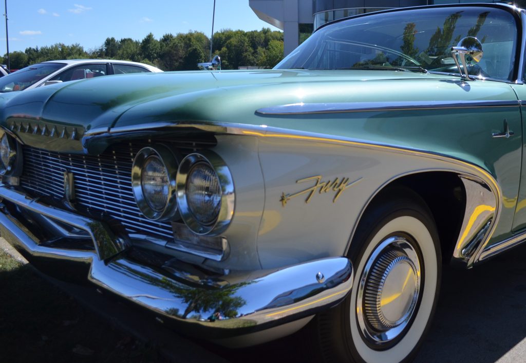 Close up of fender emblem on a 1960 plymouth Fury