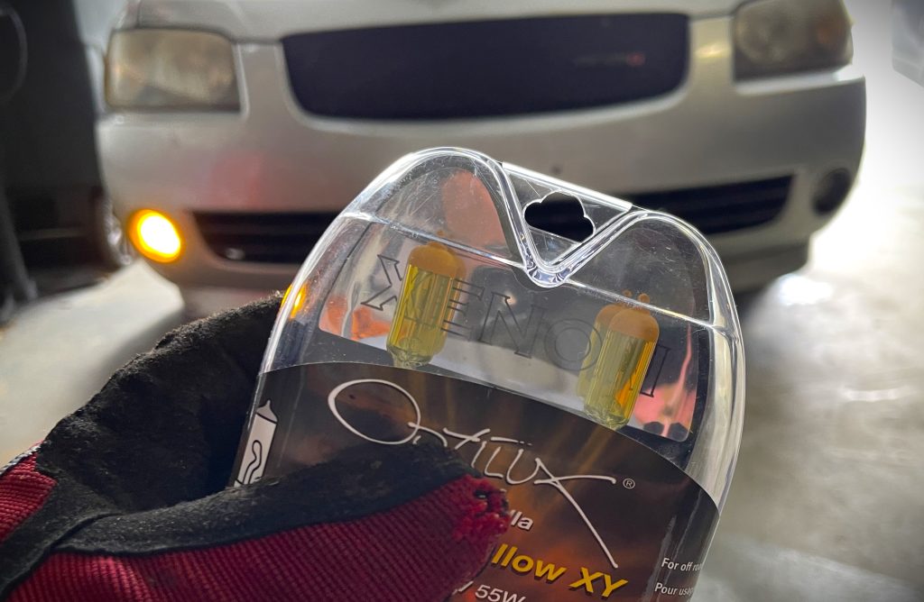 hand holding a set of automotive lights