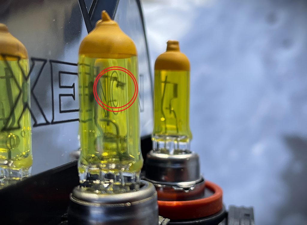 a comparison of new and old headlight bulb