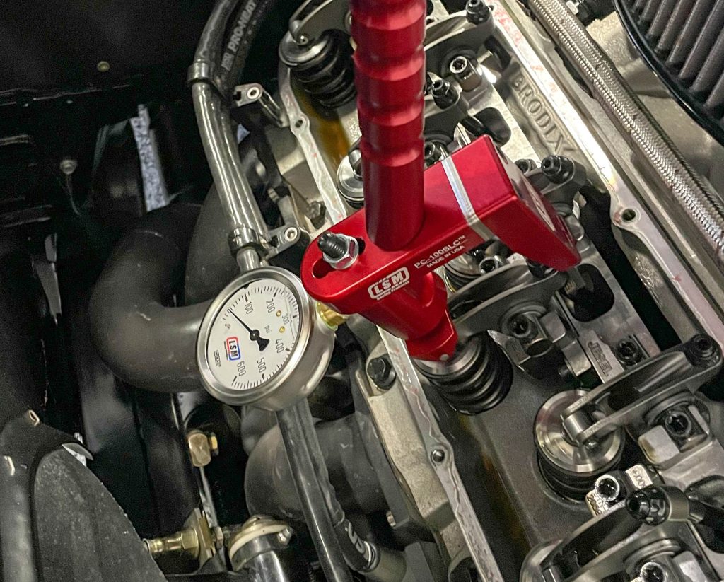 Checking valve spring pressure