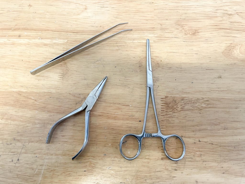 Tweezers, needle nose pliers, hemostats