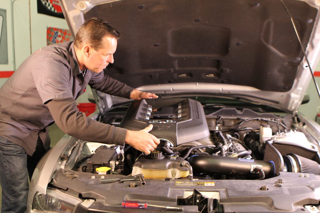 removing engine cover from a Coyote in a S197 Mustang