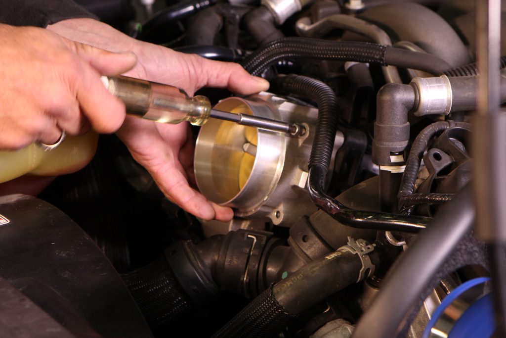 installing fasteners on a throttle body