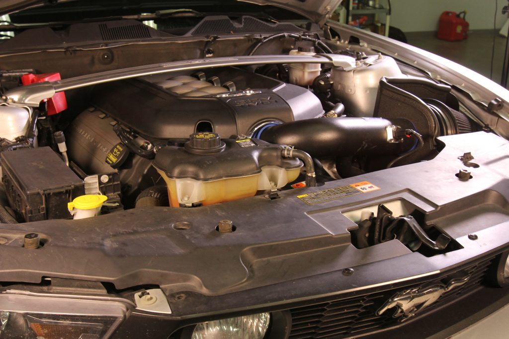 coyote 5.0L engine with intake kit in an s197 ford mustang