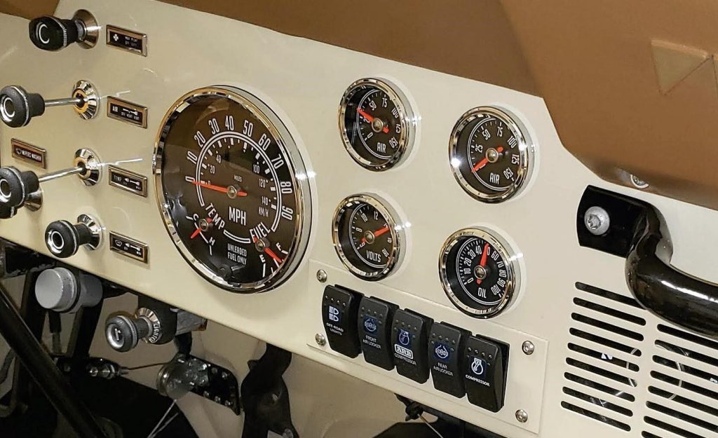 sppedhut gauges installed in a white Jeep CJ
