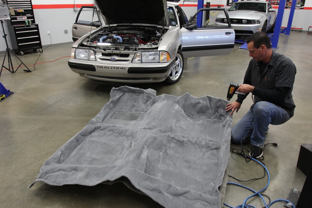 using heat gun to smooth & form new automotive carpet