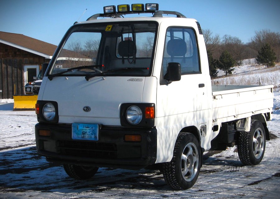 1990 subaru Sambar in snowy parking lot